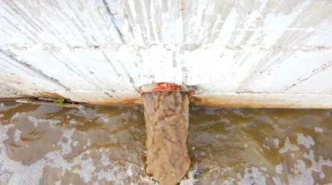 Waste pipe or drainage polluting environment. The drain carries sewage. Dirty Stock Footage 63403945