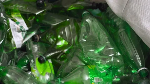 Waste of plastic cans and plastic bottles in a container. Recycling of waste. Stock-Footage 168079774