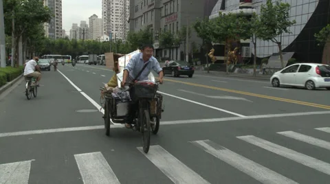 Waste recycler, pedalling, ringing hand bell Stock Footage 37695211