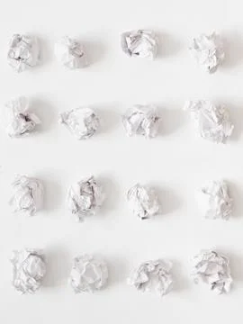 Waste reduction paper ball rows white background Stockfoto's