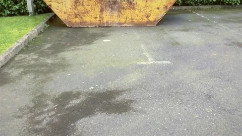 Waste skip outside on the street Stock Footage 72941648