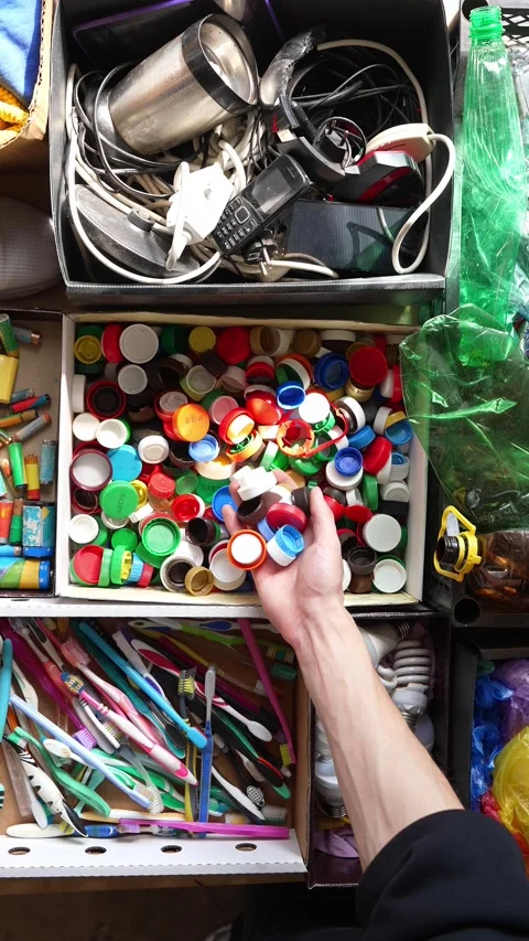 Waste sorting, collection, and disposal. Recyclable garbage. Plastic bottle caps 스톡 동영상 329275807