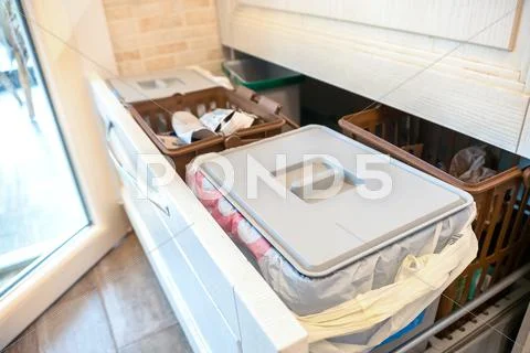 Waste sorting drawer recycling kitchen home chores Stock Photos