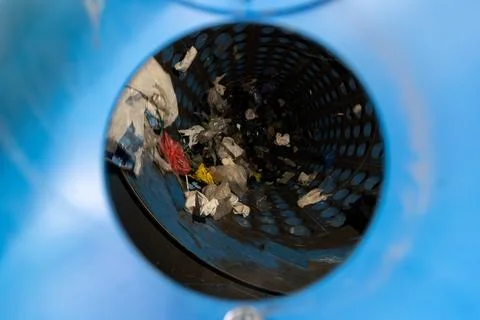 Waste sorting drum interior with plastic debris in recycling process machine Stock Photos