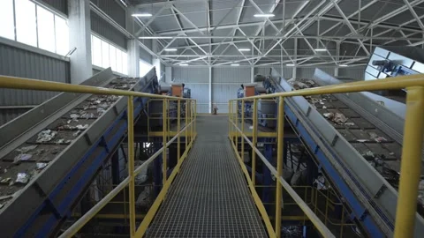Waste sorting plant conveyors filled with various household waste. Stock Footage 141418179