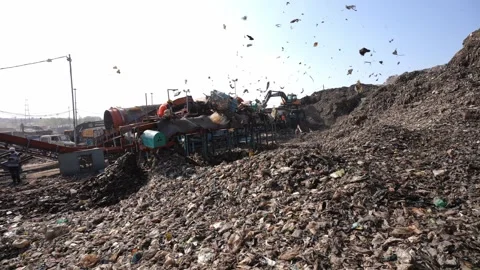 Waste Sorting Plant Operating On Garbage Mountain, Bhalswa Landfill Delhi Stock Footage 248058598
