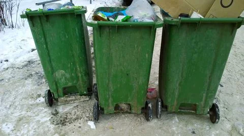 Waste in trash container and garbage in the city. Problem of cleaning, clean Stock Photos