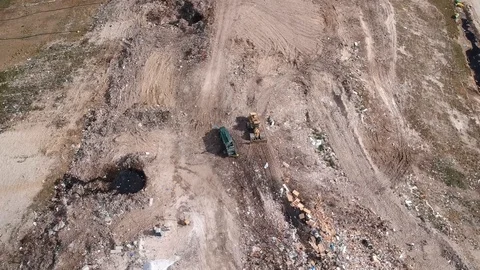 Waste Truck Dumping Load at Freeport Landfill, Grand Bahama Aerial Stock Footage 88916725