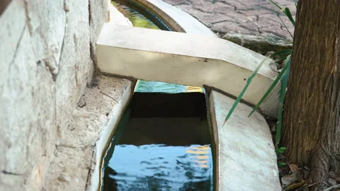 Waste water, pollution and garbage in urban canal. close up city stream Stock Footage 171400540