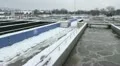 Waste water treatment facility in winter. Sewage treatment plant. HD Footage