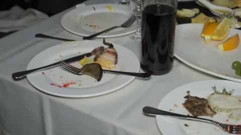 Wasted food on festive table after dinner party Stock Footage 106559596