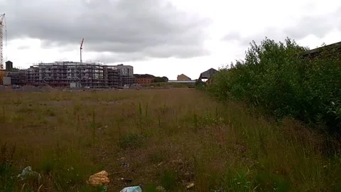 Wasteland with construction going on in the background Stock Footage 200213048