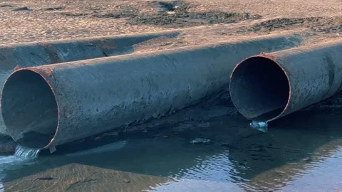 Wastewater discharged through large diameter pipes. Stock Footage 245476428