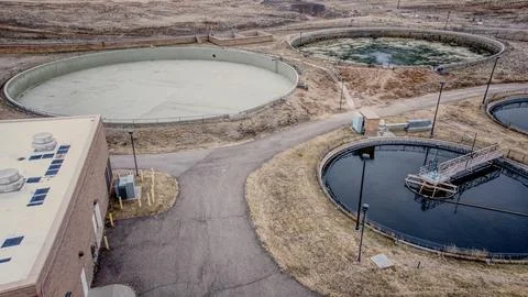 Wastewater Processing Tanks and Utility Buildings in Public Works Stock Photos