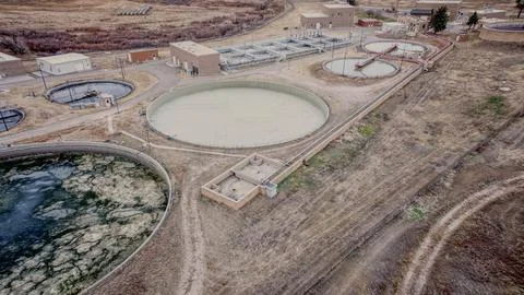 Wastewater Processing Tanks and Utility Buildings in Public Works Stock Photos