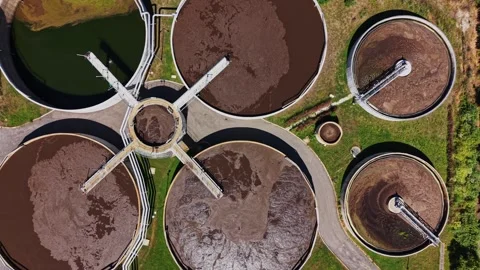 Wastewater treatment facility processes water during daylight hours 스톡 동영상 339058465