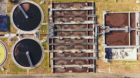 Wastewater treatment facility with processing tanks and filtration systems in Stock Footage 344778494