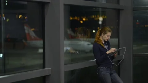 Wasting time during passenger delay woman uses videochat Stock Footage 157942095