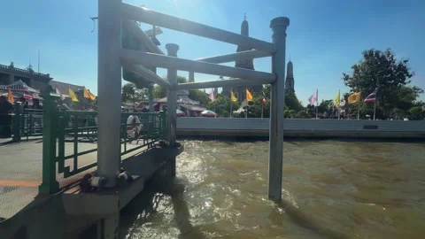 Wat Arun Pier on the Chao Phraya River in Bangkok Buddhist temple Southeast Asia Stock Footage 342126767