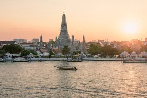 Wat Arun temple along Chao Phraya River during sunset in Bangkok, Thailand Stock Photos
