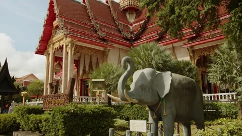 Wat Chalong Monastery and the elephant sculpture climbing camera. Phuket Stock Footage 223820436