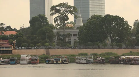 Wat Phnom Seen From Riverfront with City Skyline in Background Stock Footage 37845716