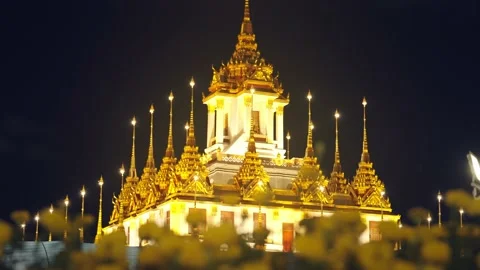 Wat Ratchanatda Temple, Loha Prasat, golden metal multi-top at night Stock-Footage 209801916