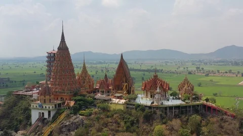 Wat tham sua or Tiger cave temple with green rice field in morning Stock Footage 126140301