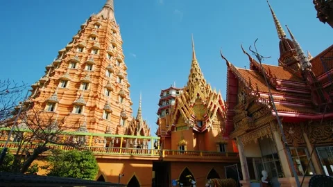Wat tham sua temple with ornate details, golden structures gleaming under bright Stock Footage 317229983