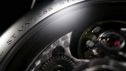 Watch back with open mechanism rotating closeup 動画素材 152079256