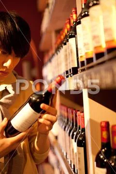 Watch Bottle Arrange Attention Asians Vertical composition Wine Shopping Variety Stock Photos