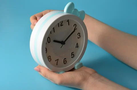 Watch with a bow on the palm. Stock Photos