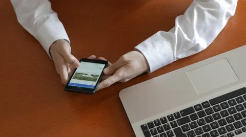 Watch facebook instead of working Stock Footage 60699605