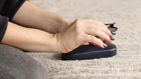 Watch as the hands demonstrate the process of opening and closing a glasses case Stock-Footage 318279229