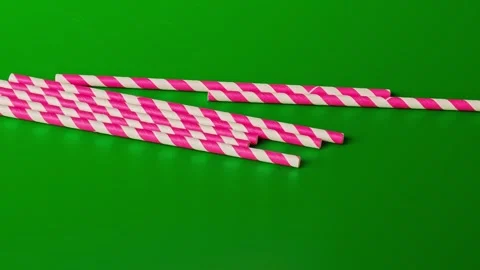 Watch how pink straws fall and create a fun pile during New Year and Christmas Stock Footage 338406291