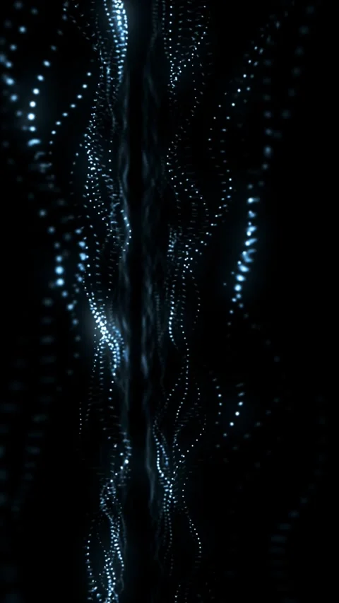 Watch illuminated particles flow fluidly in a dark setting for an abstract Stock Footage 314500001