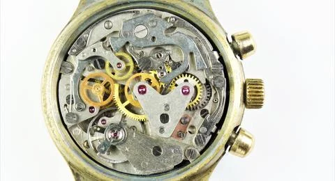 The watch is mechanical, a view of the details from the inside. Stock Photos