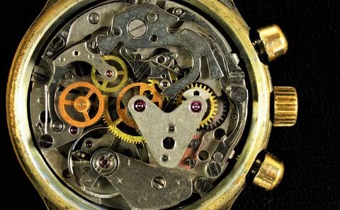 The watch is mechanical, a view of the details from the inside. Stock Photos