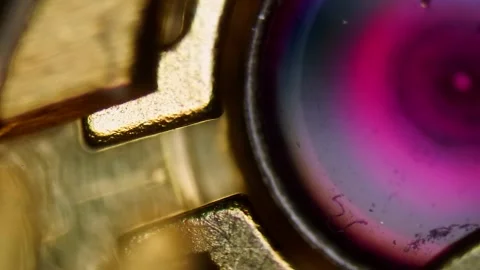 Watch Mechanism Close Up , Microscopic View of Ruby Bearings in DIC Technique Stock Footage 316104569