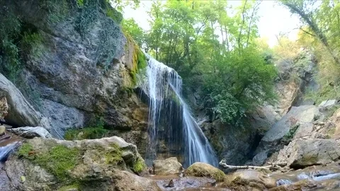 Watch a mountain waterfall Stock-Footage 84788736