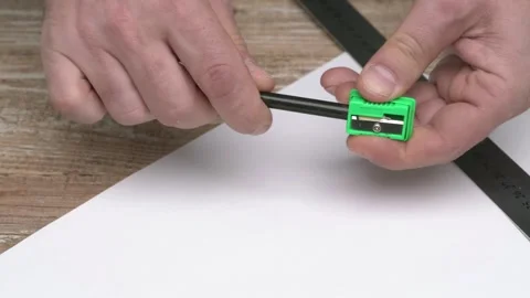 Watch the Pencil Sharpener in Action as it sharpens a sleek Black Pencil to 動画素材 291287838