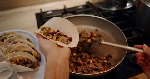 Watch the process of cooking delicious tacos in a frying pan Video stock 307935211