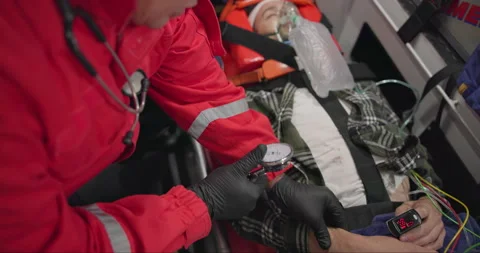 Watch, pulse and hands of a paramedic with a patient in an ambulance for rescue 스톡 동영상 252642271