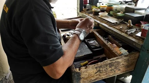 Watch repairman with simple tools Stock Footage 234946717
