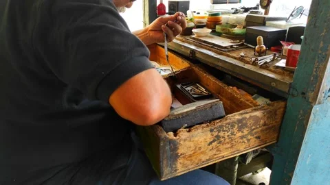 Watch repairman with simple tools Stock Footage 234947710