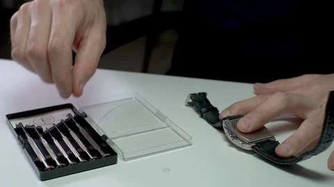 Watch Repairment with Micro Screwdriver - 2 times Slow Motion Stock Footage 129409618
