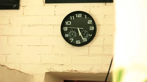 Watch with a stopwatch on a white brick wall Video stock 75681884