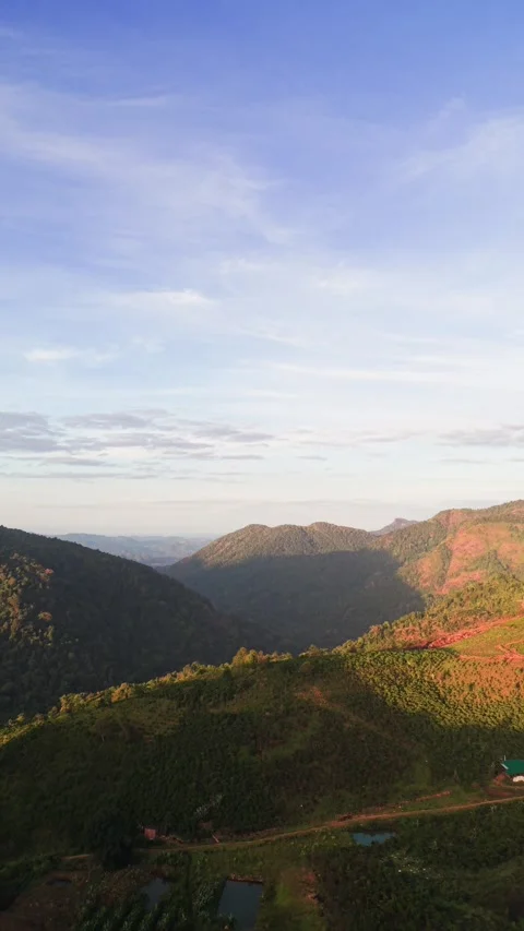 Watch as the sun sets over the hills of Lam Dong, Vietnam. The Dolly view shows 스톡 동영상 331009747
