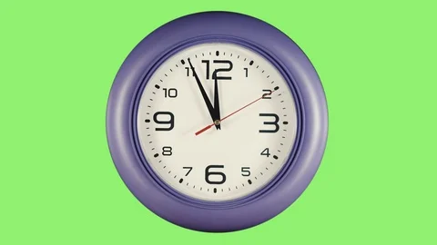 Watch a time laps on a green background Stock Footage 99699109