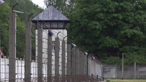 Watch tower at old prison yard with barbwire fence 4k Stock Footage 77843644